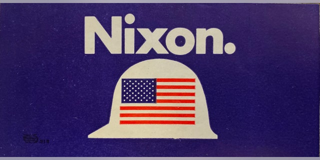 Working-class American rallied around President Nixon during the 1972 campaign, as demonstrated by this Nixon hard hat bumper sticker.