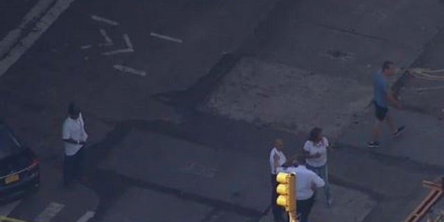 A view of an East Harlem street near where two teenage boys were shot Tuesday. One was struck in the head and was in serious condition, officials said.
