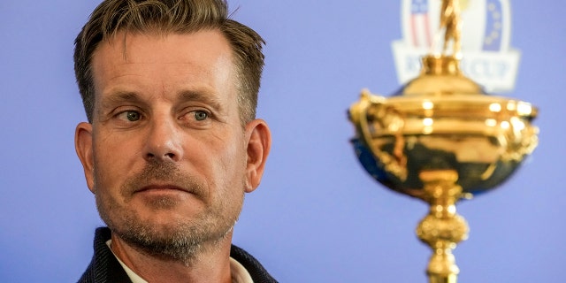 Henrik Stenson looks at the Ryder Cup Trophy during a press conference at the Marco Simone golf club in Guidonia Montecelio, on the outskirts of Rome, Italy, on May 30, 2022.