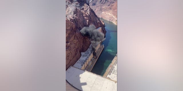 The aftermath of an explosion at the Hoover Dam is seen Tuesday, July 19, 2022, in video captured by Kristy Hairston and posted to social media.