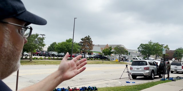 A witness to the July 4 shooting at a parade near Chicago points to where he was at the time of the shooting.