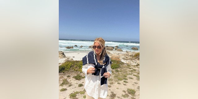 Lex Nicoleta poses on the beach in a "coastal grandmother"-inspired outfit in Carmel by the Sea, Calif., on May 6, 2022.