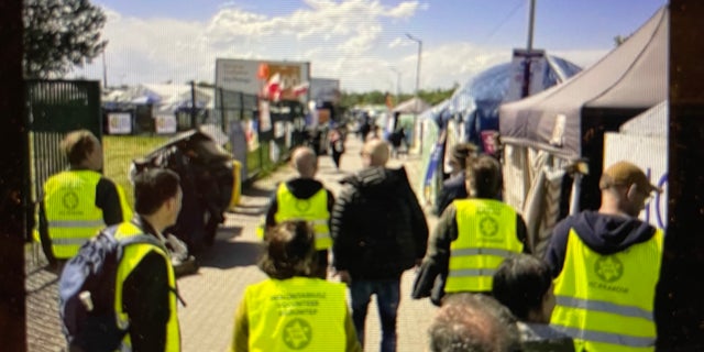 Temple members who traveled to the Ukraine-Poland border are shown amid their recent trip to bring comfort and bear witness. 