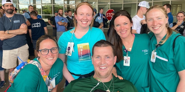 Chicago officer Danny Golden poses with nurses.