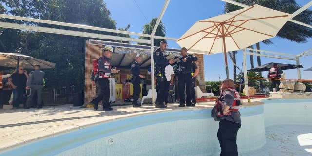A group of medical personnel respond to a call in Karmei Yosef, in central Israel, after a man was swept into a sinkhole in the pool in the middle of a private party where several people were also swimming. In addition, a 34-year-old man was injured and survived.