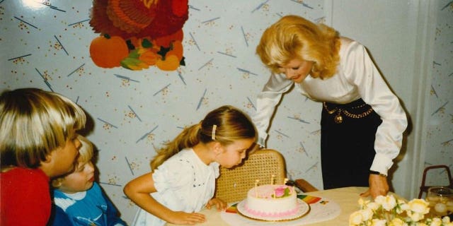 Ivana Trump celebrating a birthday with kids Ivanka, Donald Jr. and Eric.