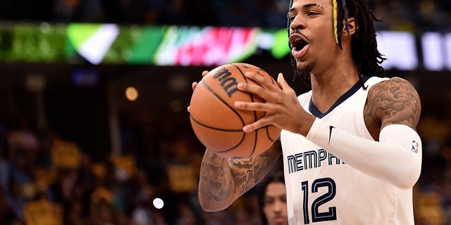 Ja Morant, #12 of the Memphis Grizzlies, reacts against the Golden State Warriors during Game One of the Western Conference Semifinals of the NBA Playoffs at FedExForum on May 01, 2022 in Memphis, Tennessee.