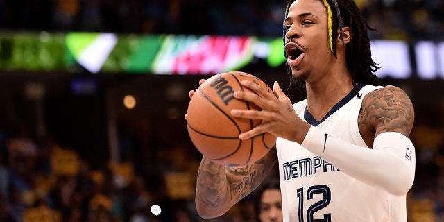 Ja Morant, #12 of the Memphis Grizzlies, reacts against the Golden State Warriors during Game One of the Western Conference Semifinals of the NBA Playoffs at FedExForum on May 01, 2022 in Memphis, Tennessee.