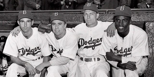 Brooklyn Dodgers, from left, third baseman John Jorgensen, shortstop Pee Wee Reese, second baseman Ed Stanky and first baseman Jackie Robinson before a Boston Braves game at Ebbets Field in New York on May 15. April 1947.