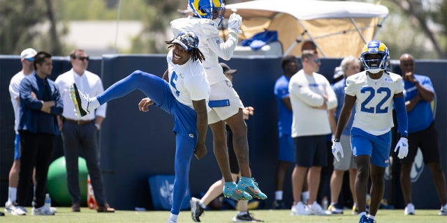 Jalen Ramsey mentors defensive backs during recovery from offseason surgery 2 Los Angeles Rams cornerback Jalen Ramsey, left, and Troy Hill, center, celebrate after a good play during NFL football practice Monday, July 25, 2022, in Irvine, Calif.