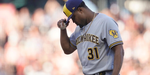 Milwaukee Brewers pitcher Jandel Gustave reacts after being called for a balk that scored San Francisco Giants' Wilmer Flores during the eighth inning in San Francisco Saturday, July 16, 2022. 