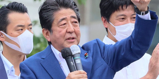 Former Japanese Prime Minister Shinzo Abe delivering a campaign speech for the ruling Liberal Democratic Party (LDP) candidate Keiichiro Asao for the Upper House election in Yokohama, suburban Tokyo, on July 6.