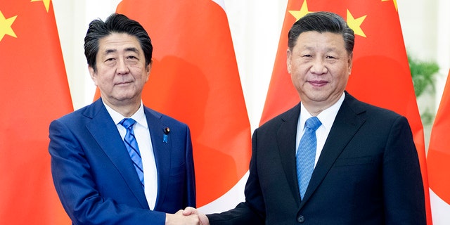 Chinese President Xi Jinping meets with Japanese Prime Minister Shinzo Abe at the Great Hall of the People in Beijing, China, Dec. 23, 2019.