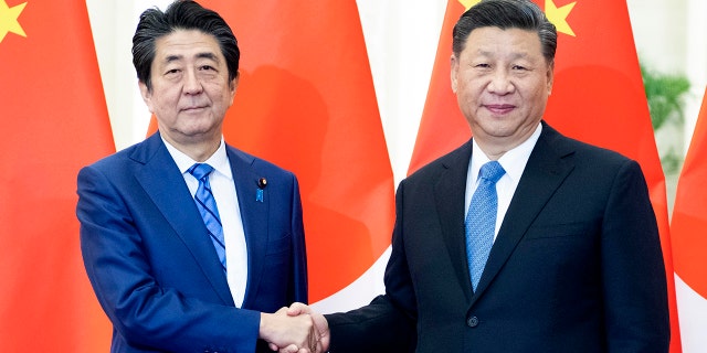 Chinese President Xi Jinping meets with Japanese Prime Minister Shinzo Abe at the Great Hall of the People in Beijing, China, Dec. 23, 2019.