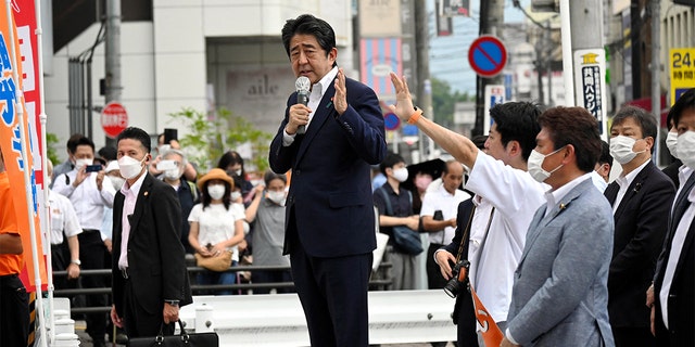 Former Japanese Prime Minister Shinzo Abe delivers a speech before he was shot from behind by a man in Nara, western Japan, July 8, 2022. 