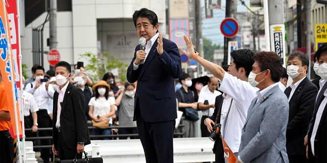 Former Japanese Prime Minister Shinzo Abe makes a speech before he was shot from behind by a man in Nara, Japan, in this photo taken by The Asahi Shimbun. Former President Trump reflected with sorrow on the former prime ministers assassination, calling him a "unifier."