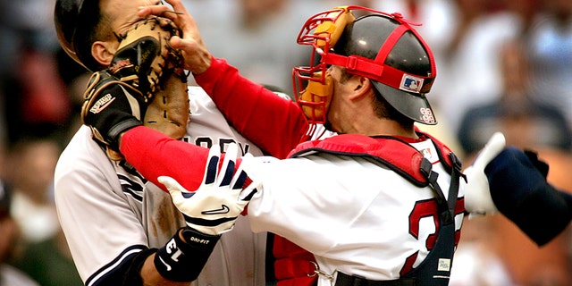 Alex Rodriguez of the Yankees and Red Sox Catcher Jason Varitek trade blows in the 3rd Inning that Precipitated a bench clearing Brawl between the two teams.  Both players were ejected from the game.