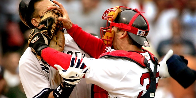 Alex Rodriguez of the Yankees and Red Sox catcher Jason Varitek trade blows in the 3rd inning that precipitated a bench clearing brawl between the two teams. Both players were ejected from the game.