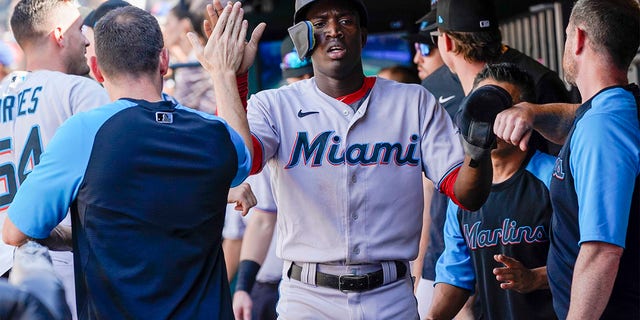 Miami Marlins' Jesus Sanchez celebrates after scoring off an RBI-single by Luke Williams during the tenth inning of a baseball game against the New York Mets, Sunday, July 10, 2022, in New York. 