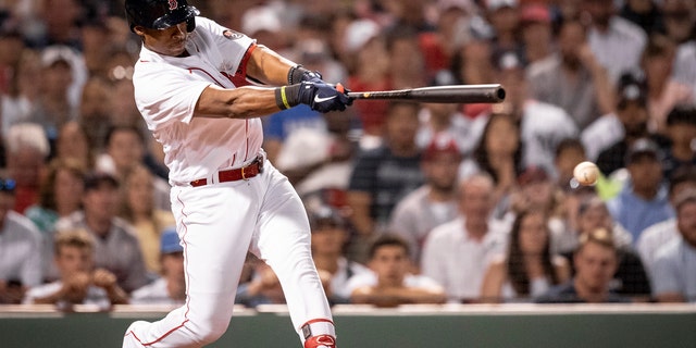 Jeter Downs of the Boston Red Sox hits a single during the tenth inning of a game against the New York Yankees July 9, 2022, at Fenway Park in Boston.