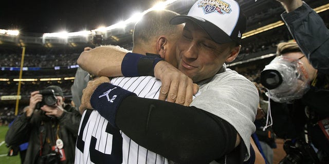 Derek Jeter, #2, and Alex Rodriguez, #13 of the New York Yankees, celebrate on the field after their 7-3 win against the Philadelphia Phillies in Game Six of the 2009 MLB World Series at Yankee Stadium on November 4, 2009 in the Bronx borough of New York City.