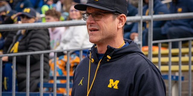Michigan Football Head Coach, Jim Harbaugh, walks out of the tunnel prior to the spring football game at Michigan Stadium on April 2, 2022 in Ann Arbor, Michigan.
