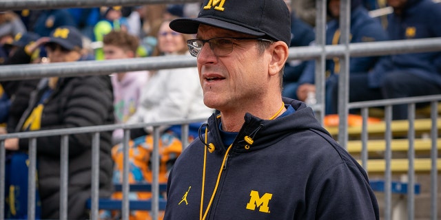 Head coach, Jim Harbaugh walks out of the tunnel prior to a game at Michigan Stadium on April 2, 2022, in Ann Arbor.