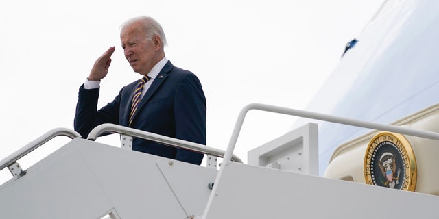 President Joe Biden returns a salute before boarding Air Force One for a trip to Cleveland to deliver remarks on the American Rescue Plan, Wednesday, July 6, 2022, in Andrews Air Force Base, Maryland.