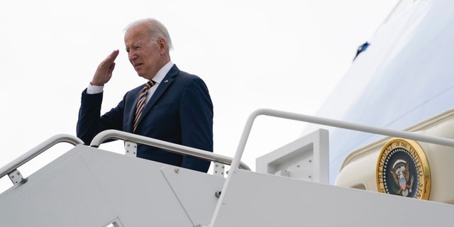 President Joe Biden returns a salute before boarding Air Force One for a trip to Cleveland to deliver remarks on the American Rescue Plan, Wednesday, July 6, 2022, in Andrews Air Force Base, Maryland.