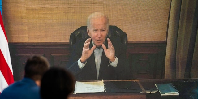 President Biden delivers remarks virtually during his meeting with his economic team to discuss lowering gas prices in the South Court Auditorium of the Executive Office Building on July 22, 2022.