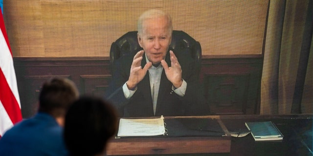 President Biden delivers remarks virtually during his meeting with his economic team to discuss lowering gas prices in the South Court Auditorium of the Executive Office Building on July 22, 2022.