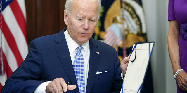 "This law and the love defense strike a blow against hate in all its forms," Biden said Tuesday of the Respect for Marriage Act.