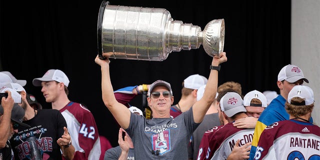 Colorado Avalanche general manager Joe Sakic lifts the Stanley Cup during a rally outside the City/County Building for the NHL hockey champions after a parade through the streets of downtown Denver, Thursday, June 30, 2022. 