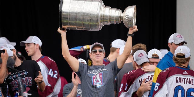 Colorado Avalanche general manager Joe Sakic raises the Stanley Cup during a rally outside the City/County Building honoring NHL hockey champions after a parade through the streets of downtown Denver, Thursday, June 30, 2022.