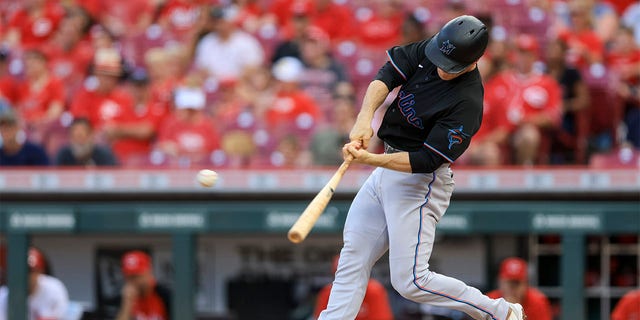Miami Marlins' Joey Wendle hits a two-RBI single during the fifth inning of a baseball game against the Cincinnati Reds in Cincinnati, Tuesday, July 26, 2022. 