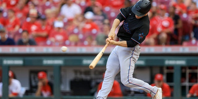 Miami Marlins' Joey Wendle hits a two-RBI single during the fifth inning of a baseball game against the Cincinnati Reds in Cincinnati, Tuesday, July 26, 2022.