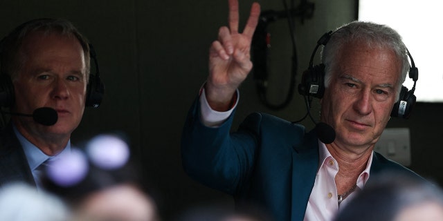 Retired tennis player John McEnroe gestures during Wimbledon's men's singles final between Serbia's Novak Djokovic and Australia's Nick Kyrgios at the All England Tennis Club in London July 10, 2022.