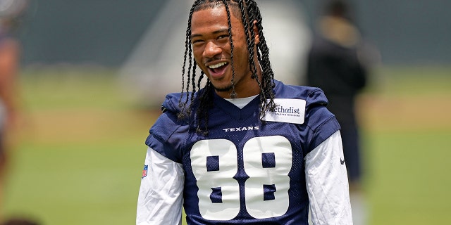 John Metchy III of the Houston Texans smiles while practicing the NFL football rookie minicamp in Houston on May 13, 2022.