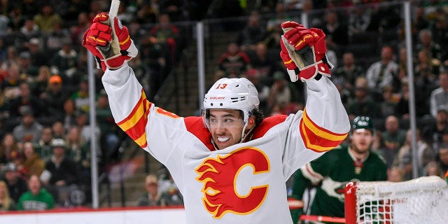 FILE - Calgary Flames left wing Johnny Gaudreau celebrates his goal on Minnesota Wild goalie Cam Talbot during the second period of an NHL hockey game Thursday, April 28, 2022, in St. Paul, Minn.