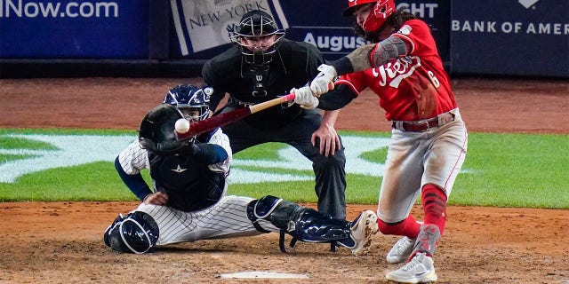 Cincinnati Reds' Jonathan India (6) hits a two-run single during the ninth inning of the team's baseball game against the New York Yankees on Tuesday, July 12, 2022, in New York.