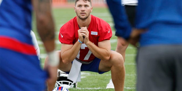 Buffalo Bills quarterback Josh Allen (17) warms up during practice at the NFL football team's training camp in Pittsford, N.Y., Sunday July 24, 2022.