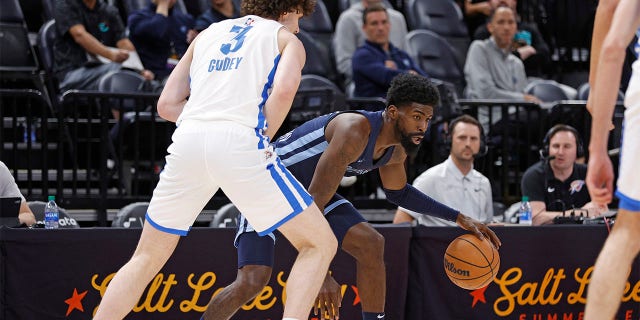 Memphis Grizzlies guard Shaq Buchanan is defended by Oklahoma City Thunder guard Josh Giddey (3) during the first half of an NBA summer league basketball game Wednesday, July 6, 2022, in Salt Lake City. 