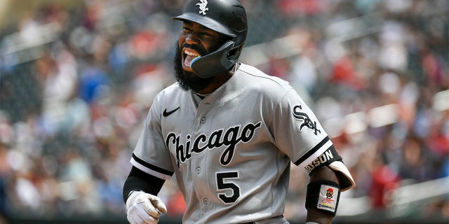 Chicago White Sox second baseman Josh Harrison shouts as he heads to the dugout after hitting a three-run home run against the Minnesota Twins during the seventh inning of a baseball game, Sunday, July 17, 2022, in Minneapolis.