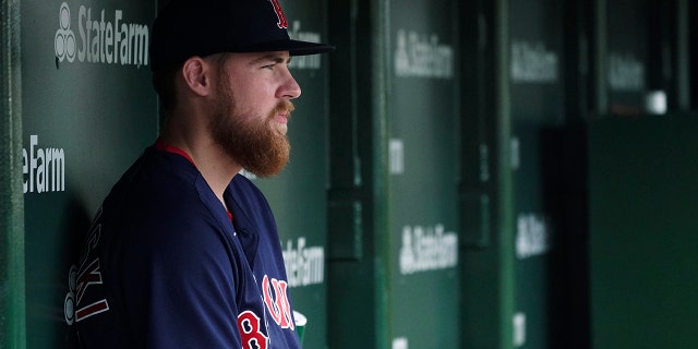 Boston Red Sox starting pitcher Josh Winckowski sits in the dugout before the team's baseball game against the Chicago Cubs in Chicago, Saturday, July 2, 2022.