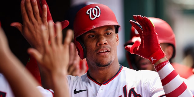 Juan Soto of the Washington Nationals celebrates with teammates after hitting a three-run home run against the Seattle Mariners during game one of a doubleheader at Nationals Park July 13, 2022, in Washington, D.C 