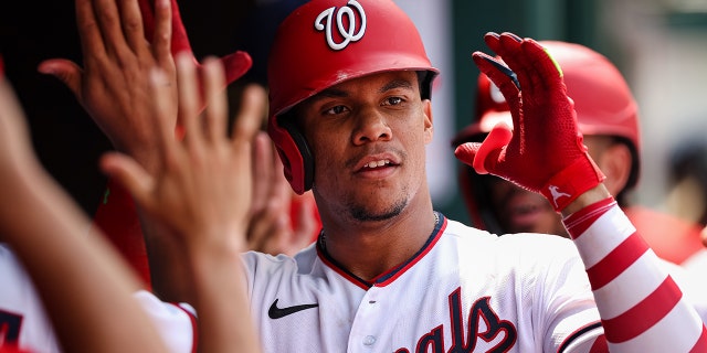 Juan Soto of the Washington Nationals celebrates with his teammates on July 13, 2022, after hitting a three-run home run against the Seattle Mariners in Game 1 of the Doubleheader at Nationals Park in Washington, DC. 