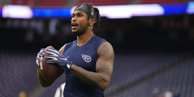 Julio Jones of the Tennessee Titans warms up against the Houston Texans prior to an NFL game at NRG Stadium in Houston, Texas, on Jan. 9, 2022.