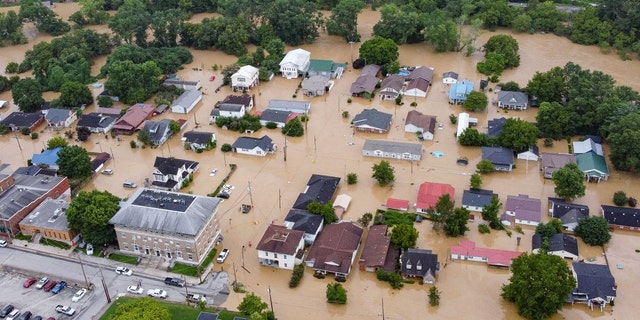 Aerial view of homes submerged under floodwaters of the North Fork Kentucky River in Jackson, Kentucky on July 28, 2022.