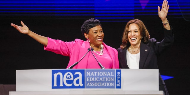 Vice President Kamala Harris, right, waves with Becky Pringle, president of the National Education Association, at the National Education Association 2022 annual meeting and representative assembly in Chicago, Illinois, on Tuesday, July 5, 2022. Harris highlighted educators role in communities across the country and the administration's investments to support students and educators, according to the White House. Photographer: Tannen Maury/EPA/Bloomberg via Getty Images 