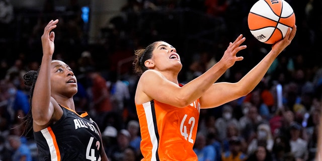 Team Wilson's Kelsey Plum, right, drives to the basket past Team Stewart's Jewell Loyd during the second half of a WNBA All-Star basketball game in Chicago, Sunday, July 10, 2022.